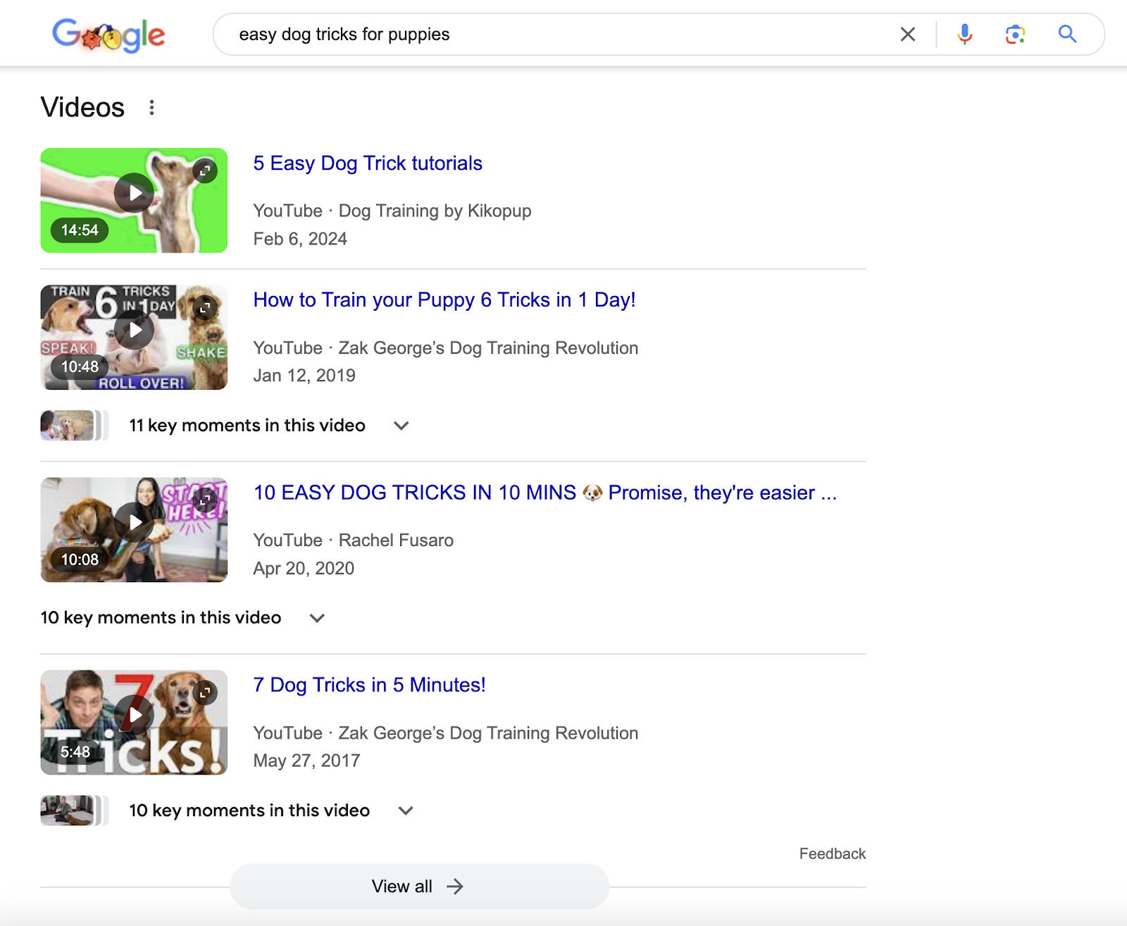 Video carousel on the SERP has four videos and view all button.